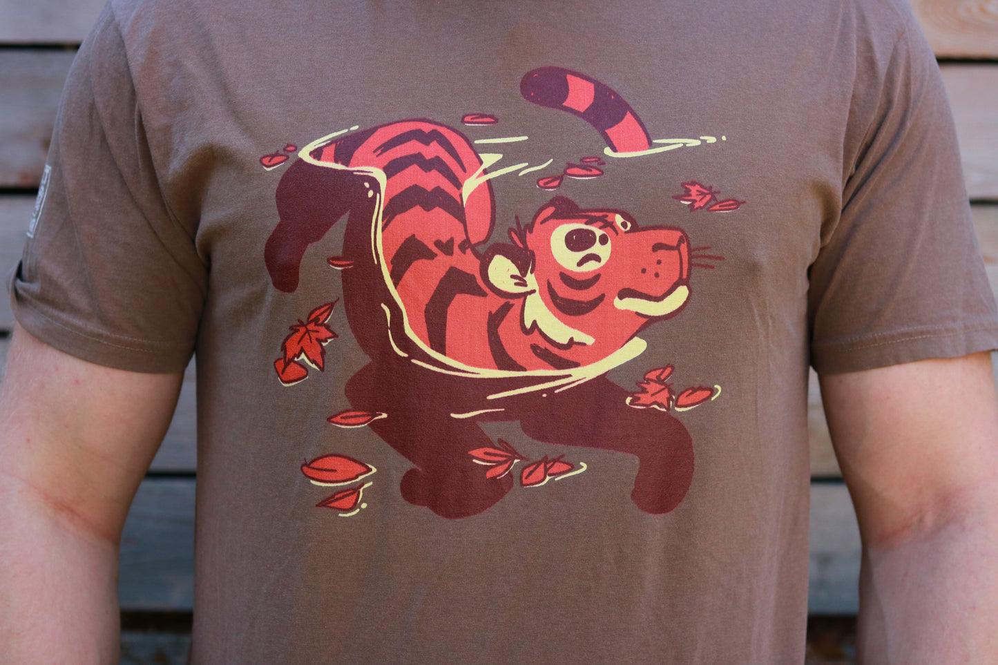 T-shirt with a red tiger design on a brown background